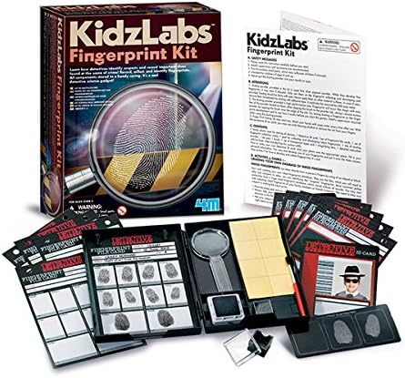 The image shows the 4M KidzLabs Finger Print Kit, a STEAM-based set from 4M designed for children to learn and identify fingerprints. It includes fingerprint cards, magnifying glasses, ink pads, clear tape, and various pamphlets and booklets with instructions and activities.