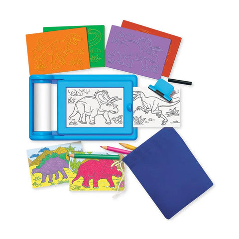 The 4M KidzMaker Dinosaur Rub Art Studio from 4M includes a blue sketch board with a dinosaur drawing, several stencils featuring dinosaur templates, colored pencils, and a small roller. The kit also showcases two colored dinosaur drawings. All items are neatly arranged around a blue pouch.