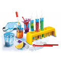 The Clementoni Science & Play - LAB My First Chemistry Set by Clementoni features safety goggles, test tubes filled with colorful liquids, a test tube rack, a pipette, a funnel, and various scientific tools. Some test tubes emit steam in this modern chemistry laboratory display, which also includes a glass of ice and liquid with a lemon wedge.
