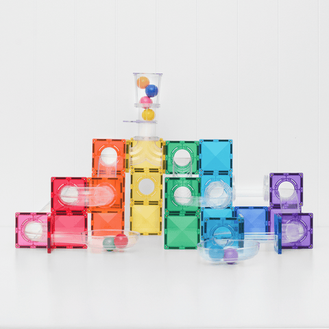 Child building with the Connetix Bright Ball Run Pack