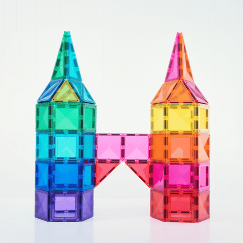 Child building with Connetix bright magnetic tiles