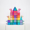 Colorful castle made of magnetic tiles on a white background