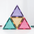 Four triangular colorful objects on a white background