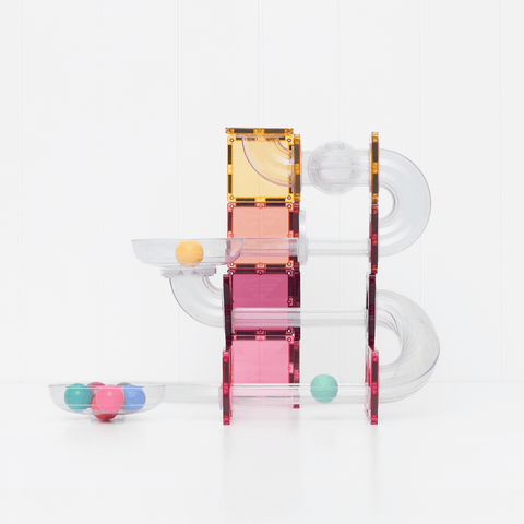 Child building with the Connetix Pastel Ball Run Pack