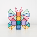 Child building with Connetix pastel magnetic tiles