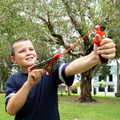 Child launching the Cooee Outdoor Sky Glider