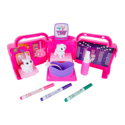 Toy grooming set with pink carrying case, toys, and Crayola markers on a white background