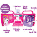 Pink toy grooming set with various accessories on a white background