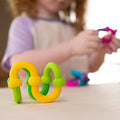 Child building with Fat Brain Plip Links