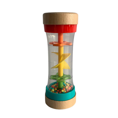 The HAPE Beaded Raindrops by HAPE is a clear, hourglass-shaped sensory toy filled with colorful beads and featuring a yellow spiral inside. The top and bottom edges are crafted from light wood, accented with red and teal plastic sections near the ends. When turned, the beads move through the spiral to produce soothing raindrop sounds, making it perfect for any toddler.