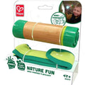 The image shows the HAPE Hand-Powered Flashlight, designed for eco-friendly explorers ages 4 and up. This flashlight features a bamboo body with green plastic ends and comes in eco-friendly packaging. The package displays a child using the flashlight and highlights its plant-based plastic composition.