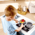 Control knobs and stovetop detail on the Hape Deluxe Kitchen with Running Water