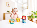 Baby grasping a Hape Dynamic Number Block