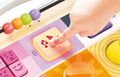 Baby playing with the Hape Explore & Learn Sensory Play Board