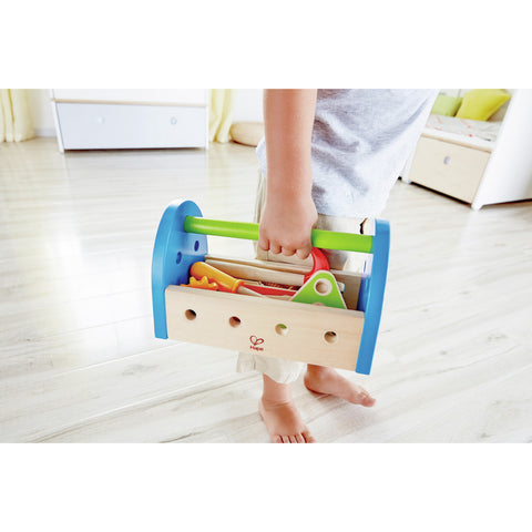 Child playing with the Hape Fix-It Tool Box