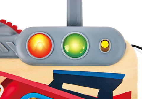 Close-up of Hape Little Racer's Busy Board with red, green, and yellow lights on a white background