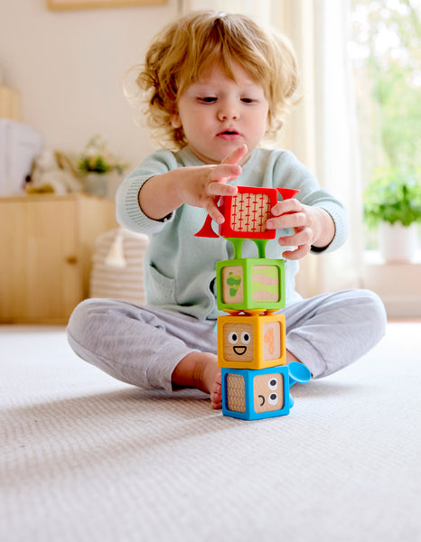 Hape Suction & Sensory Blocks stuck to a bathtub wall