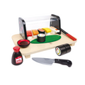 Hape sushi play set with wooden board, sushi rolls, knife, and soy sauce on a white background