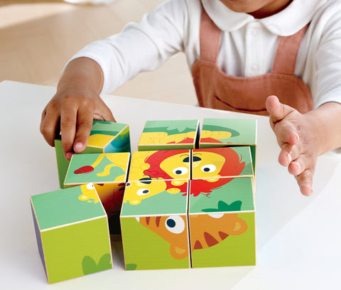 Child playing with Hape Wild wooden puzzle blocks