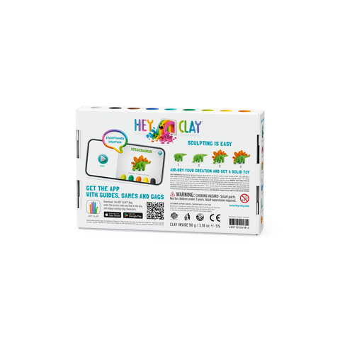 The packaging of the Hey Clay 6 pack - Dinos (Stegosaurus, Pachycephalosaurus, Brachiosaurus) displays an app tutorial that provides colorful clay instructions for crafting dinosaurs, emphasizing significant sensory development benefits. The box includes a list of contents, safety warnings, and app compatibility information. Next to playful illustrations of dinosaurs is the tagline "Sculpting is easy.