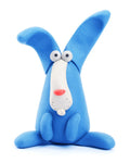 A quirky and playful rabbit from the Hey Clay Single Pack - Rabbit by Hey Clay sits upright. Made from modeling clay, it features exaggerated long ears, wide eyes, a white snout, and a small pink nose. Its whimsical design makes it ideal for play-based learning with the Hey Clay Play-Set.