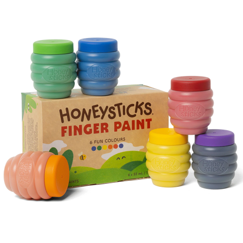 Set of Honeysticks finger paint containers with a cardboard box on a white background