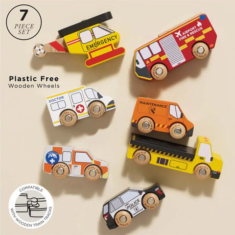 Set of seven plastic-free wooden toy vehicles on a beige background