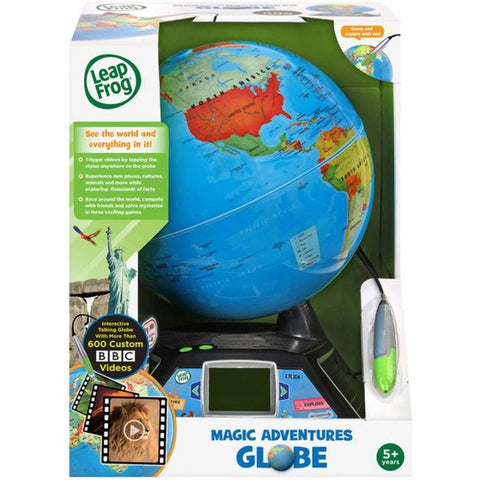 The image displays a Leapfrog Magic Adventures Globe toy in its packaging. The box showcases an interactive learning globe accompanied by a stylus and a small screen base. The packaging accentuates features such as videos, facts, explorers' activities, and indicates suitability for children aged 5 and up.