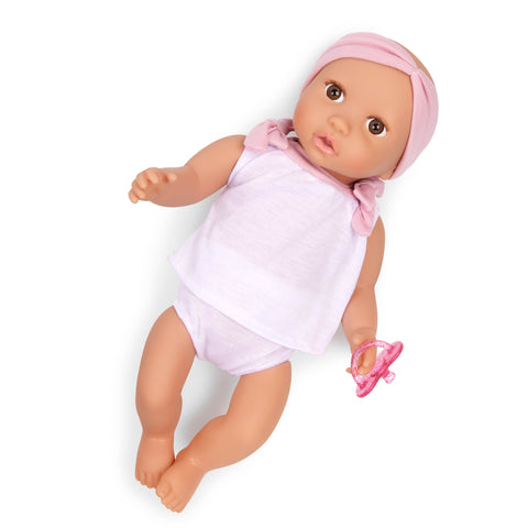 Lullabay doll wearing a pink outfit and headband on a white background