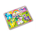 Melissa & Doug Unicorn Chunky Puzzle fully assembled, showing the rainbow and five unicorn pieces - blue, pink, yellow, white and purple - set in the castle and meadow scene