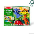 Melissa & Doug Chunky Dinosaur Puzzle packaging box beside the puzzle board with T-Rex, Stegosaurus, Triceratops and a crested dinosaur pieces in place