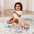 Child playing with colorful blocks on a carpeted floor
