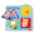 Wooden peek-a-boo toy with cartoon characters and wooden balls on a blue background