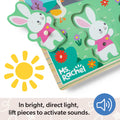 Children's wooden puzzle with bunny design and 'Ms. Rachel' branding, featuring a sun icon and sound activation text.