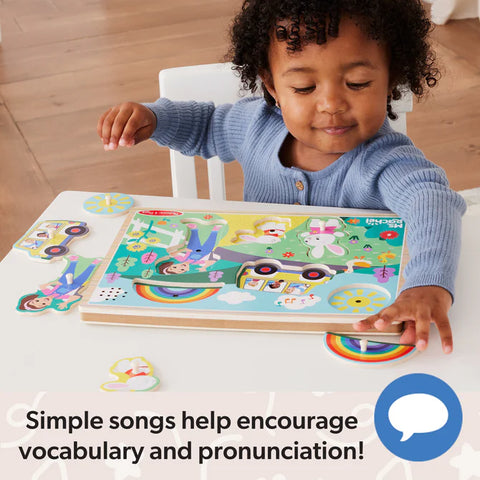 Child playing with a colorful puzzle at a table, with text about simple songs helping with vocabulary and pronunciation.