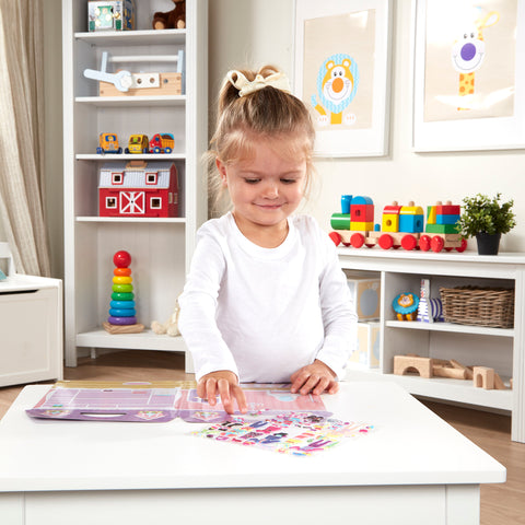 Child playing with Melissa & Doug Dress Up puffy sticker set