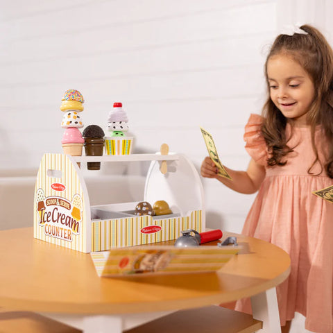 Melissa & Doug ice cream counter with a cone stacked with wooden scoops