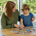 Children playing the Orchard Toys Tractor Tractor Matching Game