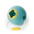 The QUUT Ballo Bucket - Green is a spherical, teal-colored item with a yellow circular opening and a white cord attached to a yellow handle. Made from BPA-free, rubbery or plastic material, this product features smart design elements and is possibly intended as a toy or an interactive object by the brand QUUT.