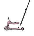 Close-up side view of the push bar attachment point on the Scoot & Ride Highwaykick 1 Push & Go in Wildberry