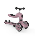 Rear diagonal view of the Scoot & Ride Highwaykick 1 Push & Go in Wildberry in ride-on mode