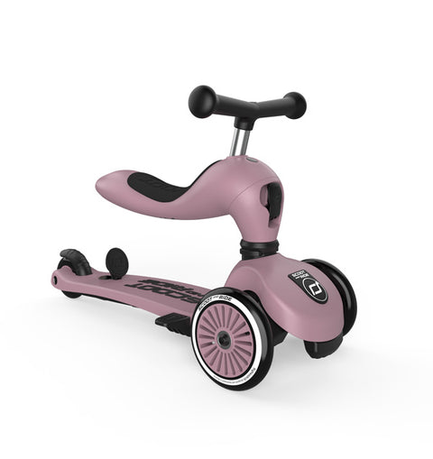 Rear diagonal view of the Scoot & Ride Highwaykick 1 Push & Go in Wildberry in ride-on mode