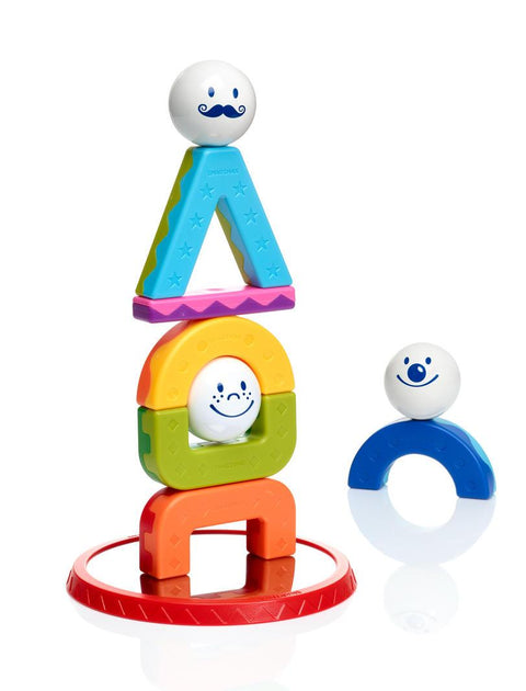 The SmartMax My First Acrobats features a colorful stack of geometric shapes and smiling faces balanced on a red circular base.