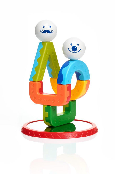The SmartMax My First Acrobats is a vibrant plastic stacking toy that includes interlocking shapes in orange, yellow, blue, green, and red. It features two white, round pieces with smiley faces on top.