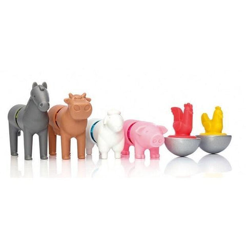 The SmartMax My First Farm Friends (16 pc) collection from SmartMax includes a grey horse, brown cow, white sheep, pink pig, and a set of egg holders shaped like half shells with red and yellow chickens sitting on top. The animals, made from colorful plastic, are all standing in a line.