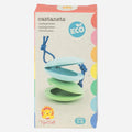 A box of eco-friendly TIGER TRIBE Castanets, designed as an educational musical tool for children aged 1-5, includes pastel green and blue castanets tied with a blue cord. The bio plastic packaging features text in multiple languages and showcases a playful lion character from Tiger Tribe.