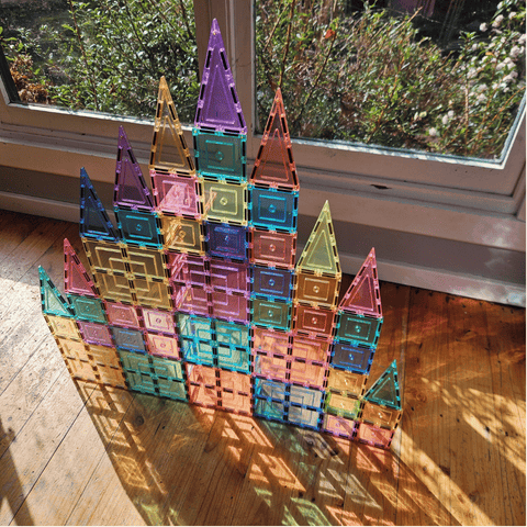 Tall pastel TileTek magnetic tile castle with multiple triangular spires