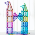 Two tall pastel TileTek magnetic tile towers connected by an arched triangle bridge