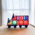 TileTek magnetic tile truck with two wooden peg dolls riding on top