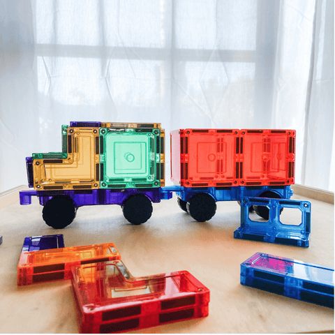 Purple, green and red TileTek magnetic tile truck and trailer with scattered tiles